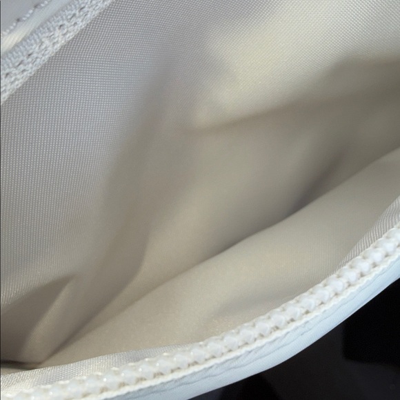 Lululemon EUC cream Crossbody bag with lots of storage. Clean in and out. - Picture 8 of 8